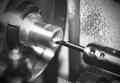 Boring involves enlarging a hole or cavity to produce circular, internal grooves.